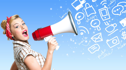 Retro style woman holding megaphone